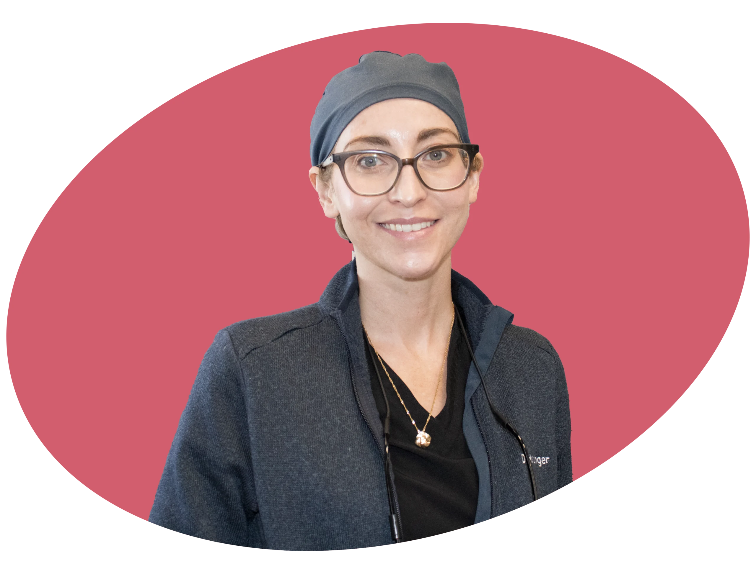 Image of a dentist wearing a cap smiling for a picture